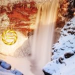 Skogafoss waterfall winter vertical