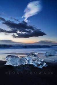 Nacreous clouds over ice beach