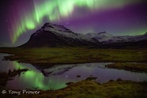 mountain northern lights reflection