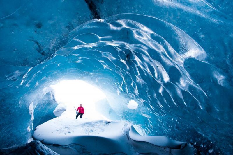 Ice cave guide with shovel