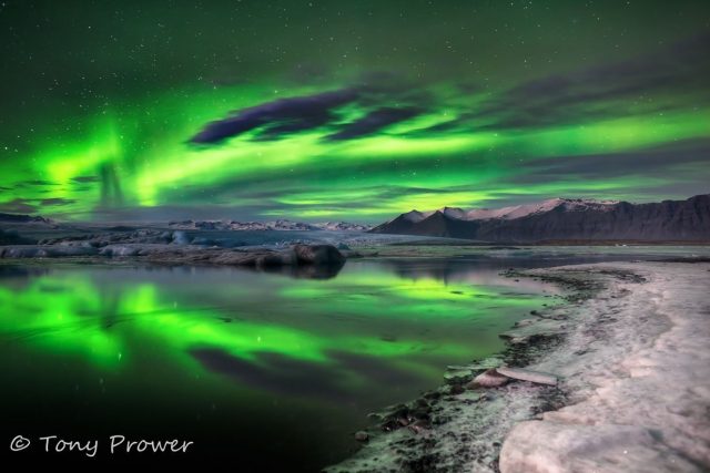 Northern lights glacier reflection