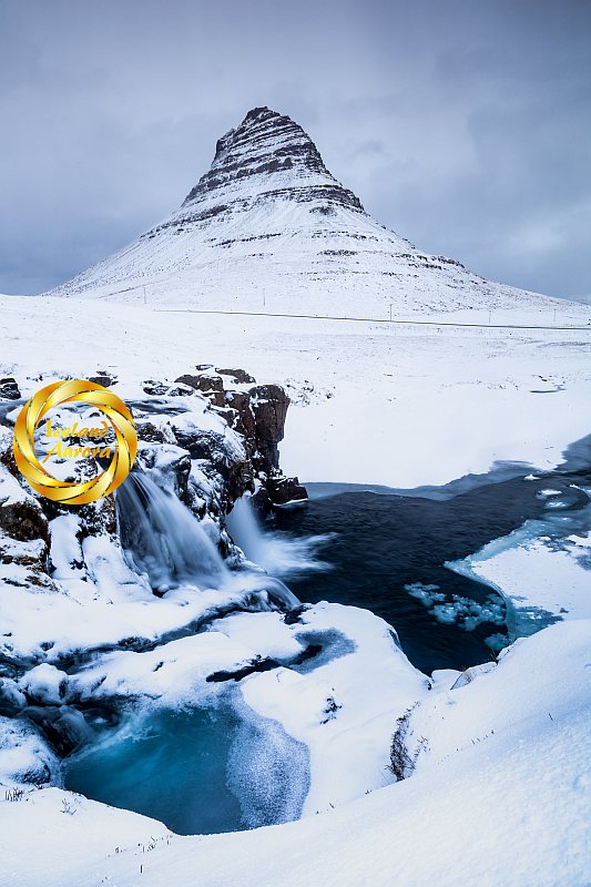 Kirkjufellsfoss waterfall snow