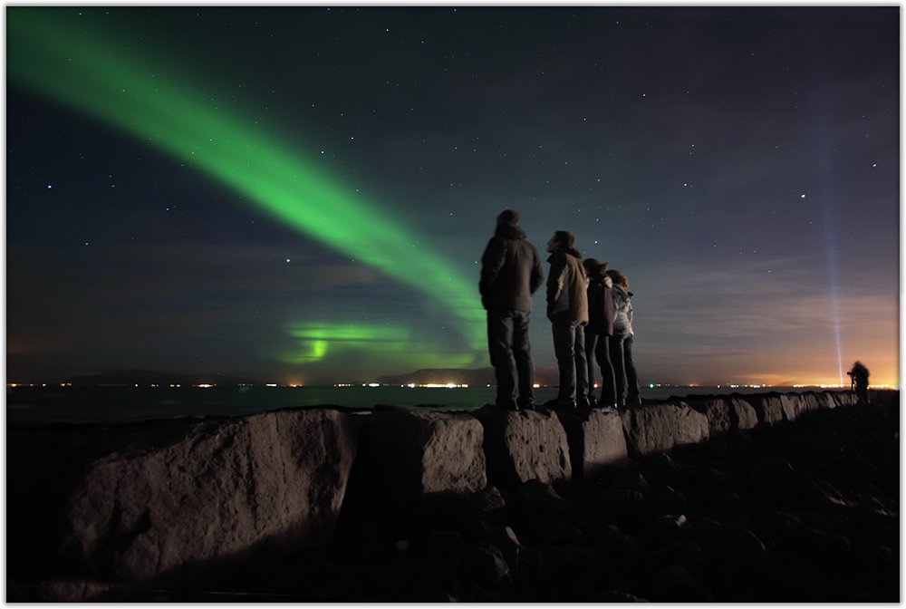 tourist watching the northern lights.